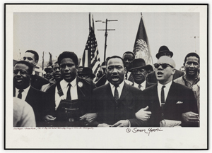 Photograph of Martin Luther King Jr. Marching Arm in Arm with Civil Rights Activists.