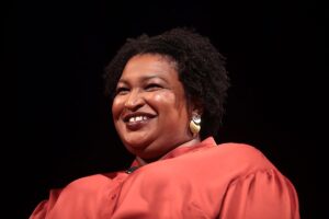 Stacey Abrams close up against black background