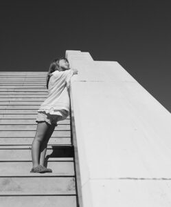 Picture of a young girl on a stair case.