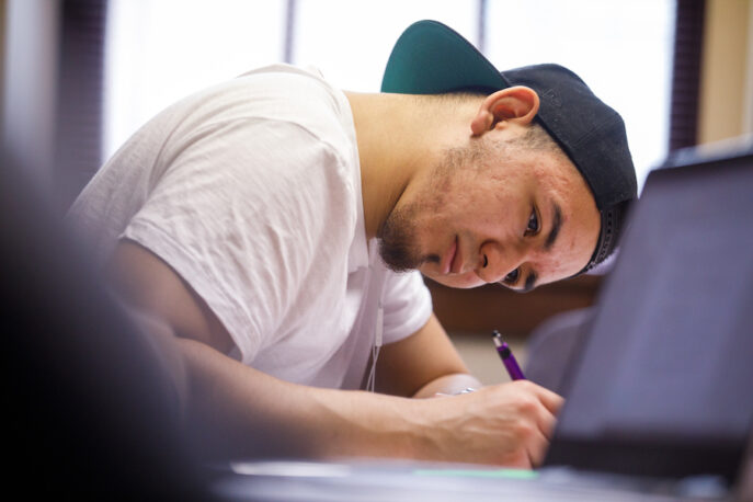 Marco Antonio Colmenares writing in class.