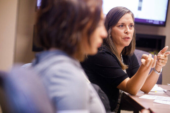 Professor Carrie Booth Walling addressing students in class.