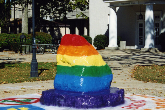 The Rock on Albion College's campus, painted with the colors of the pride flag.