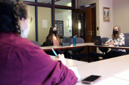 Students in class with professor Carrie Booth Walling.